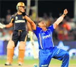 Rajasthan Royals Pravin Tambe (3/26) celebrates after claiming hat-trick against Kolkata Knight Riders; (below) Shane Watson scored 31 runs and bagged three wickets. BCCI