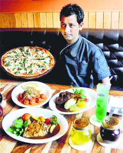 A chef displays the authentic Italian dishes at Zolas.	Photo: Manoj Mahajan