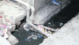 A water supply pipe passes through a sewage line