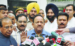 Delhi BJP president Dr. Harsh Vardhan with party MLAs talks to mediapersons after submitting a memorandum to Lt Governor Najeeb Jung in New Delhi on Tuesday. 