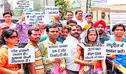A group of deaf volunteers appeal to the public to cast their votes at Chandra Charya square in Haridwar on Tuesday