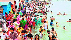 Devotees take a holy dip in the Ganga at Har-ki-Pauri in Haridwar on the pious occasion of Ganga Saptami on Tuesday