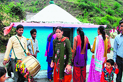 Devotees seek blessings at the Bhadraj temple amid beating of traditional drums at the Dhan Bhadraj fair in Tehri district on Tuesday