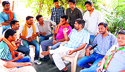 Former Nainital BJP MP Bal Raj Pasi discusses political scenario with workers at the BJP election office, Ved Ashram , in Haridwar on Tuesday