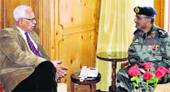 Chief Engineer, Project Beacon, Brigadier RK Sharma with Governor NN Vohra at Raj Bhawan in Srinagar on Tuesday. A Tribune photograph