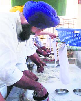 Picture of humility: Revenue Minister Bikram Majithia at Takht Sri Keshgarh Sahib on Tuesday