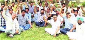 UP IN ARMS: Booth-level officers raise slogans during a meeting in Fazilka on Tuesday