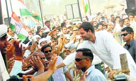 Congress vice-president Rahul Gandhi meets his supporters during an election rally in Mirzapur, Uttar Pradesh, on Tuesday