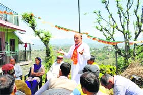 BJP candidate Narinder Thakur addresses a party meeting