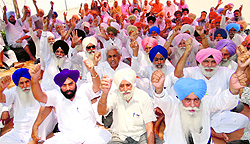 PRTC pensioners shout slogans during their protest in Bathinda on Wednesday