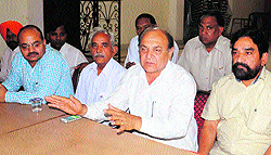 Congress workers from Rampura Phul address mediapersons in Bathinda on Wednesday