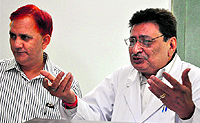 Dr Dalbir Singh (right) addresses a press conference at the PGI in Chandigarh on Wednesday