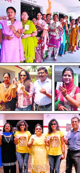 Responsible citizens: 1) Women voters show their voter cards while standing in a queue in Dehradun.2) Actress Mahi Khanduri with her parents after casting her vote in Dehradun. 3) Would be bride Rashi Thapa shows her ink mark after casting vote. 4) Famous mountaineer twin sisters Tashi and Nungshi with their parents outside a polling booth in Dehradun on Wednesday