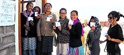Women wait in a queue to cast their votes at the Skalzangling poll booth in Leh on Wednesday