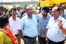 Anil Kumar Kathpal, Divisional Railway Manager (DRM), Ambala, interacts with railway officials at the Bathinda railway station on Thursday