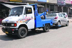 A traffic police vehicle tows a car in Bathinda on Thursday