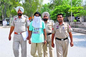 Police officials take the accused auto driver to district courts