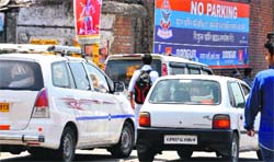 There is no end to the menace of traffic jams. Haphazardly parked cars in front of no parking sign boards near Clock Tower add to this problem in Dehradun. A Tribune photograph
