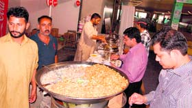 A Pakistani food stall prepares specific food flavours for Amritsaris during The Pakistan Show at Trillium Mall in Amritsar on Friday.