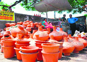 Earthen pots, vessels, surayis put up for sale as the mercury touched 39C in Haridwar on Friday.