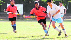 Girls in action during a hockey match at Welham Girls School in Dehradun on Friday.