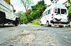 The potholed Dharamsala-McLeodganj road. Photo: Kamaljeet