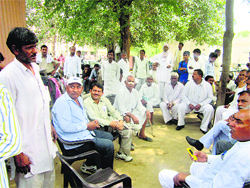 Relatives of the victims demand the arrest of the accused at the Civil Hospital in Hisar on Friday.