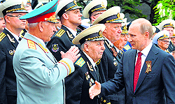 Russia's President Vladimir Putin with navy officers and veterans during his visit to Sevastopol on Friday