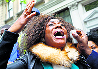 A protestor demonstrates against the kidnapping of girls in Nigeria, outside the Nigerian Embassy in London on Friday