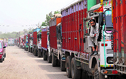 Trucks loaded with wheat bags stranded outside the FCI godown in Bathinda on Saturday