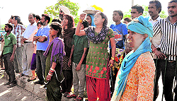 Residents of the colony protest against the UT Administration while the drive is under way