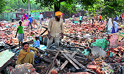 Families salvage household goods
