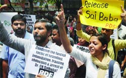 Students clamour for an immediate and unconditional release of Prof G.N. Saibaba, outside the Maharashtra Sadan in New Delhi on Saturday. Tribune Photo: Mukesh Aggarwal