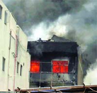 A view of the fire at a plastic factory in Mayapuri, West Delhi on Saturday. Tribune photo