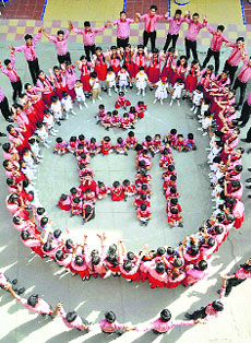 Schoolchildren celebrate Mothers Day by making a human chain at a school in Moradabad on Saturday.