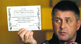 Vyacheslav Ponomaryov, separatist people's mayor of Slaviansk, holds a referendum ballot in Slaviansk on Saturday.