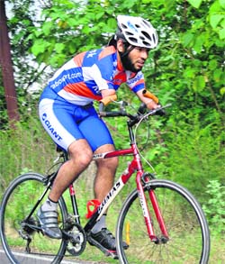 A differently abled cyclist, Jagwinder Singh, takes part in the Chandigarh State Cycling Championship on Sunday.