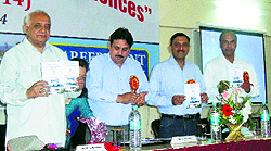 VC of Career Point University, Prof PL Gautam, releases a seminar document in Hamirpur