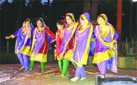 Artistes perform during a function at the hill resort of Patnitop on Saturday.