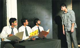 A scene from the play 'Zameen ka Sawal' being staged at Natrang Studio in its Sunday theatre series.