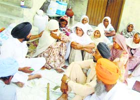 The grieving family in Hassanpur village