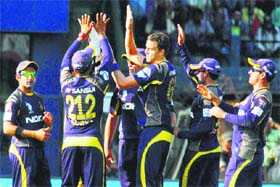 Kolkata Knight Riders players celebrate the fall of Kings XI Punjab wicket at Barabati stadium in Cutack on Sunday