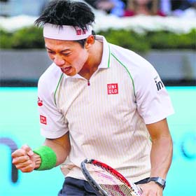 Japans Kei Nishikori celebrates after winning a point during his semifinal against David Ferrer at the Madrid Open on Saturday
