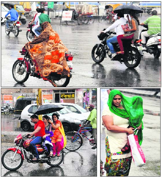 People run to protect themselves from getting soaked in rain that lashed the region on Monday.