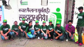 Indian Institute of Management, Indore, interns after clearing posters from murals in Dehradun on Monday