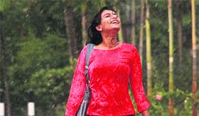 A girl enjoys getting drenched in rain in Jalandhar on Monday afternoon.
