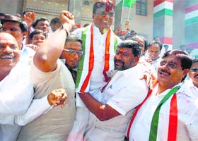 Telangana Congress president Punnala Lakshmaiah celebrates the partys victory in municipal elections in Hyderabad on Monday