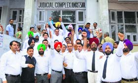 Members of the Amritsar Bar Association protest in Amritsar on Monday.