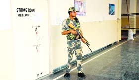 A paramilitary jawan stands guard outside a strong room in Bathinda on Monday. The counting for the Lok Sabha elections would be conducted on May 16.