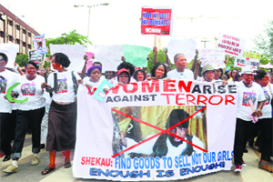 Protesters demonstrate to press for the release of missing Chibok schoolgirls in Lagos on Monday.